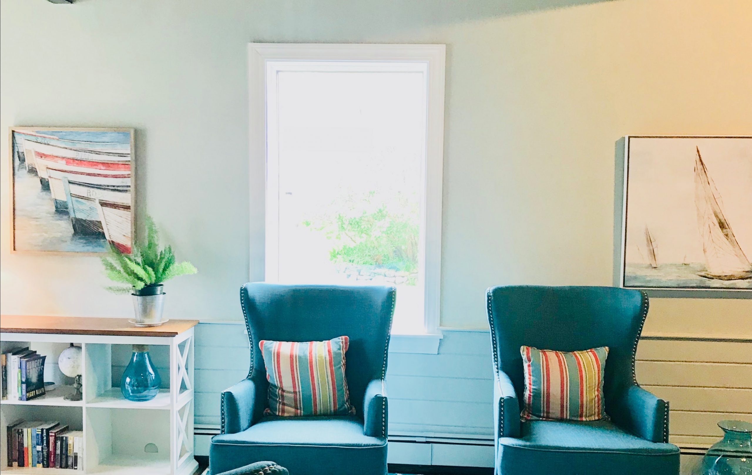teal chairs and bright pillows